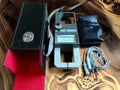 Metra Blansko PK 210 analog clamp meter with carrying case, test leads, and black accessory pouch
