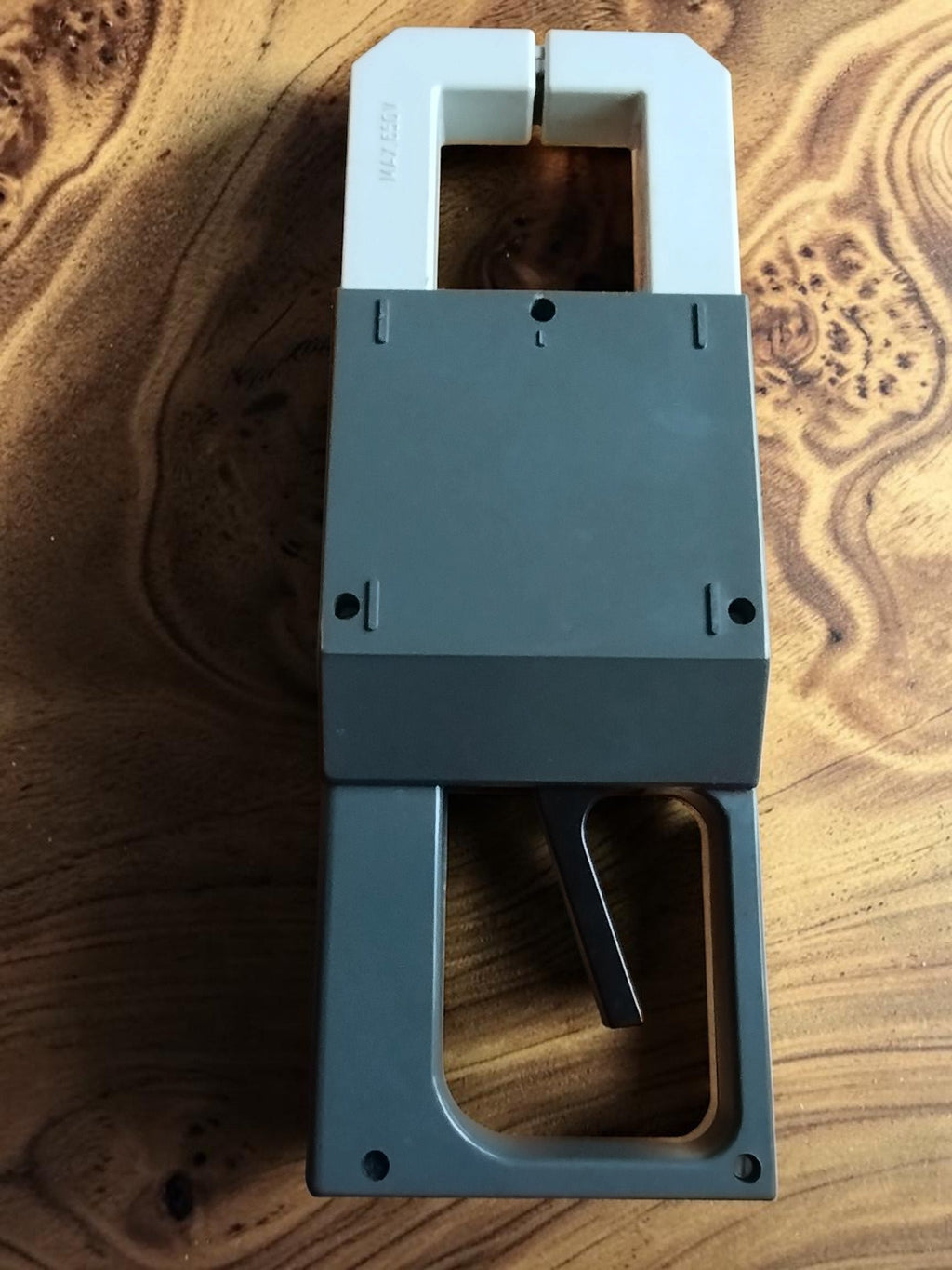 Rear view of the Metra Blansko PK 210 clamp meter showing the housing, handle, and measuring jaws
