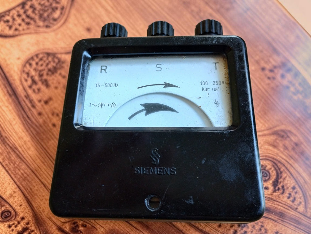 Vintage Siemens phase sequence indicator with R-S-T dial, embossed Siemens logo and black housing
