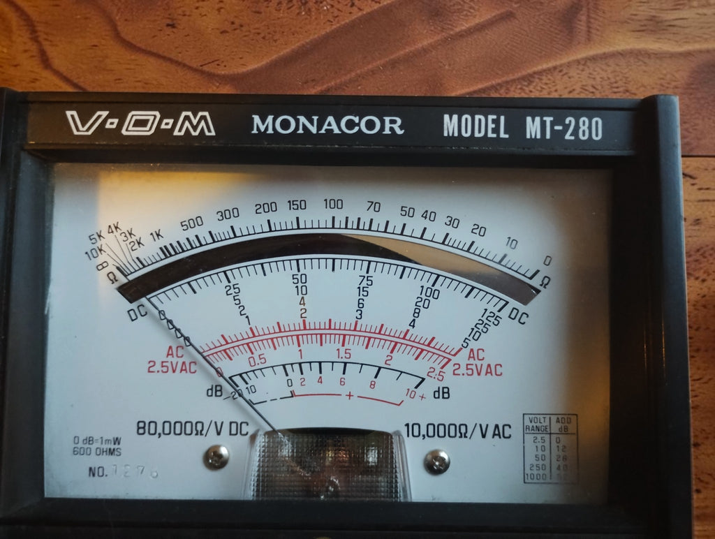 Close-up of the Monacor MT-280 meter scale showing the DC, AC and dB ranges
