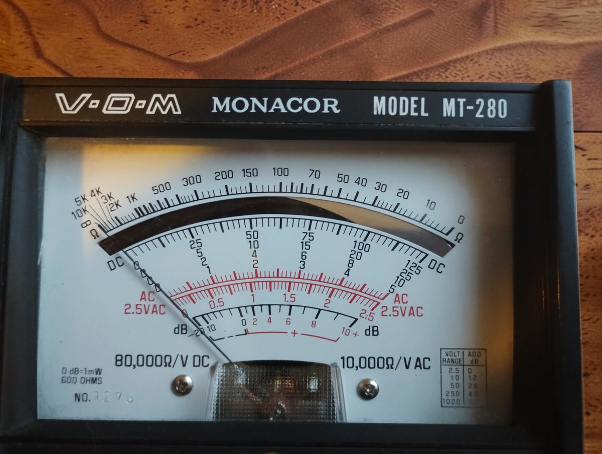 Close-up of the Monacor MT-280 meter scale showing the DC, AC and dB ranges
