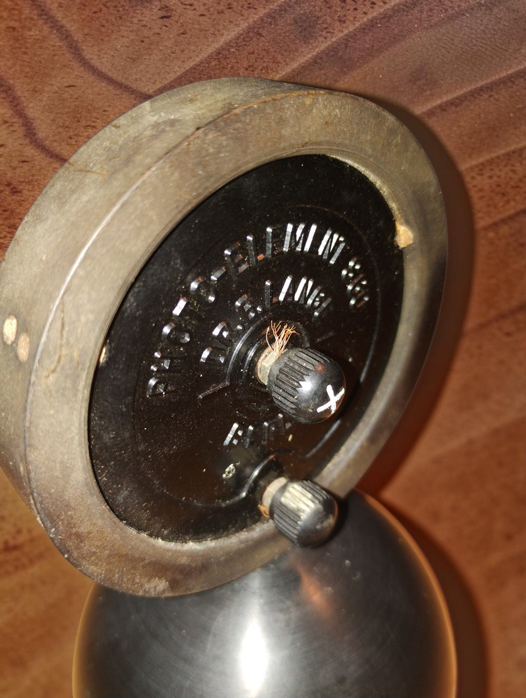 Angled rear view of the Dr. B. Lange S 60 photocell showing the metal rim, terminals and exposed wire strands
