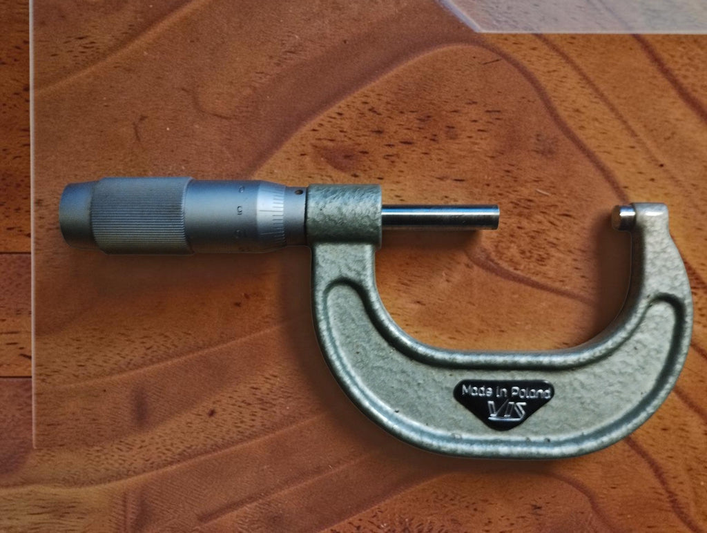 Back of the VIS 25–50 mm outside micrometer showing the VIS logo and Made in Poland marking.
