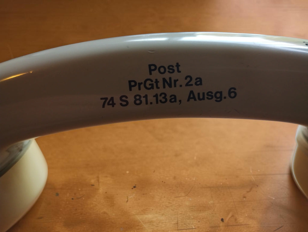 Close-up of the Post PrGt Nr. 2a marking and 74 S 81.13a, Ausg. 6 inscription on the telephone test handset.
