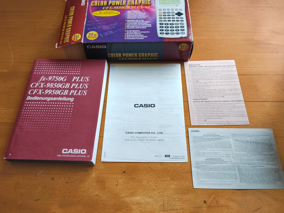 Casio CFX-9850GB PLUS-WE calculator box with German user manual and accompanying printed documentation.
