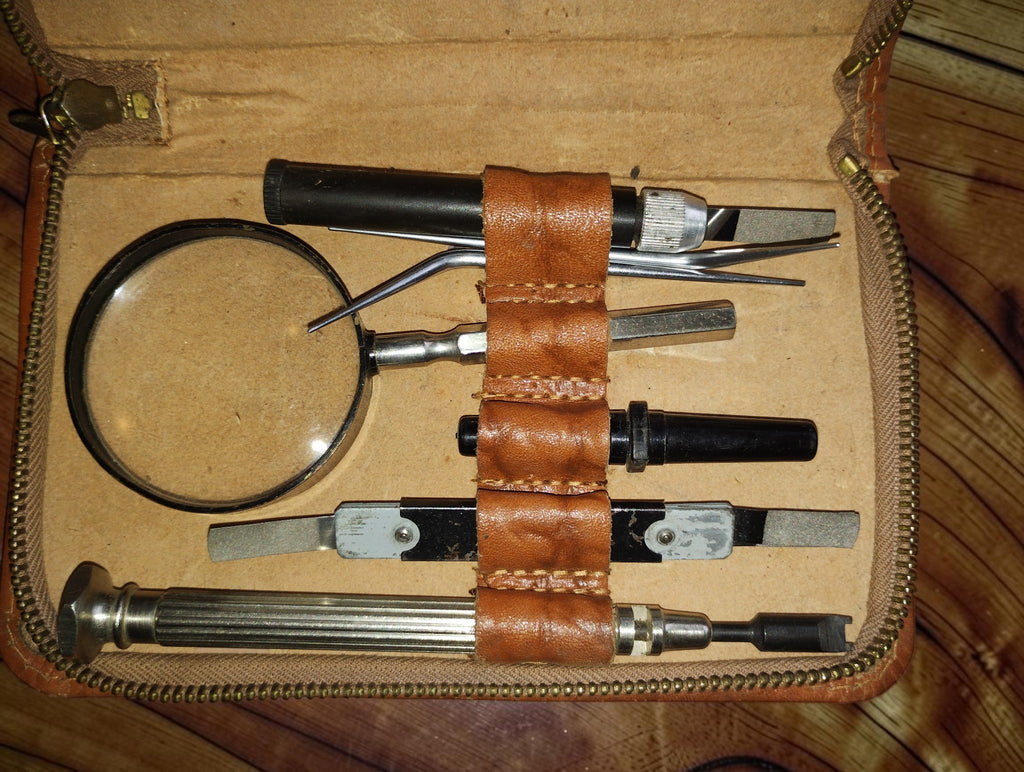 Detail of the files, adjustment tools and magnifying glass inside the vintage Siemens leather case
