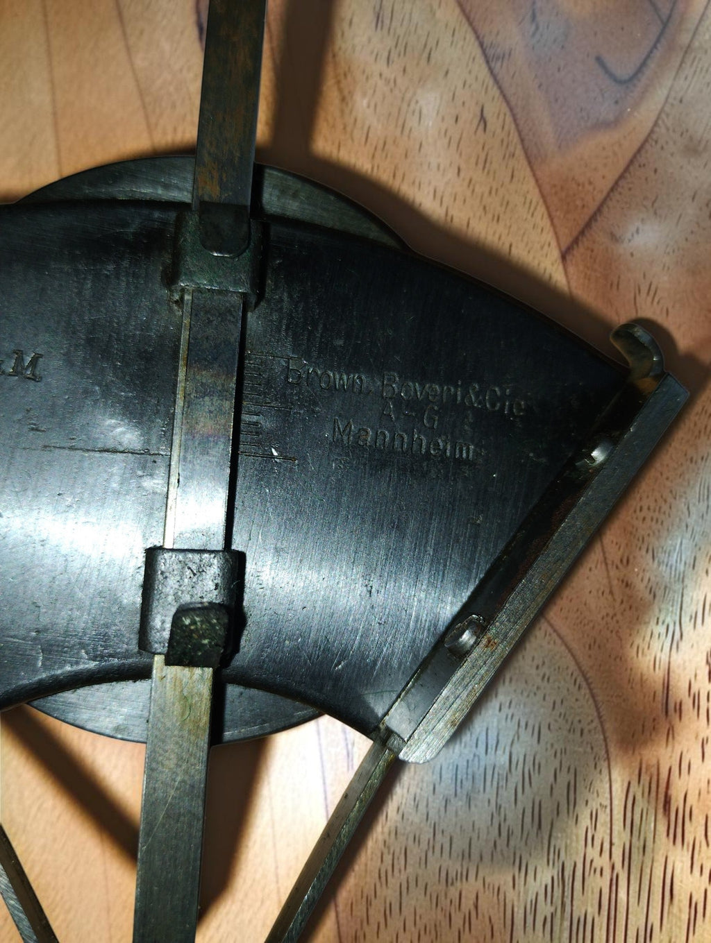 Close-up of the Brown, Boveri & Cie Mannheim maker's inscription, metal guides and scale markings.
