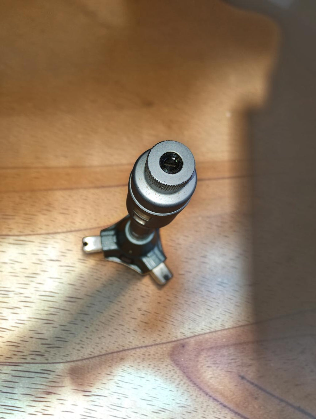 Top view of the TESA three-point internal micrometer, showing the knurled adjustment knob and measuring head.
