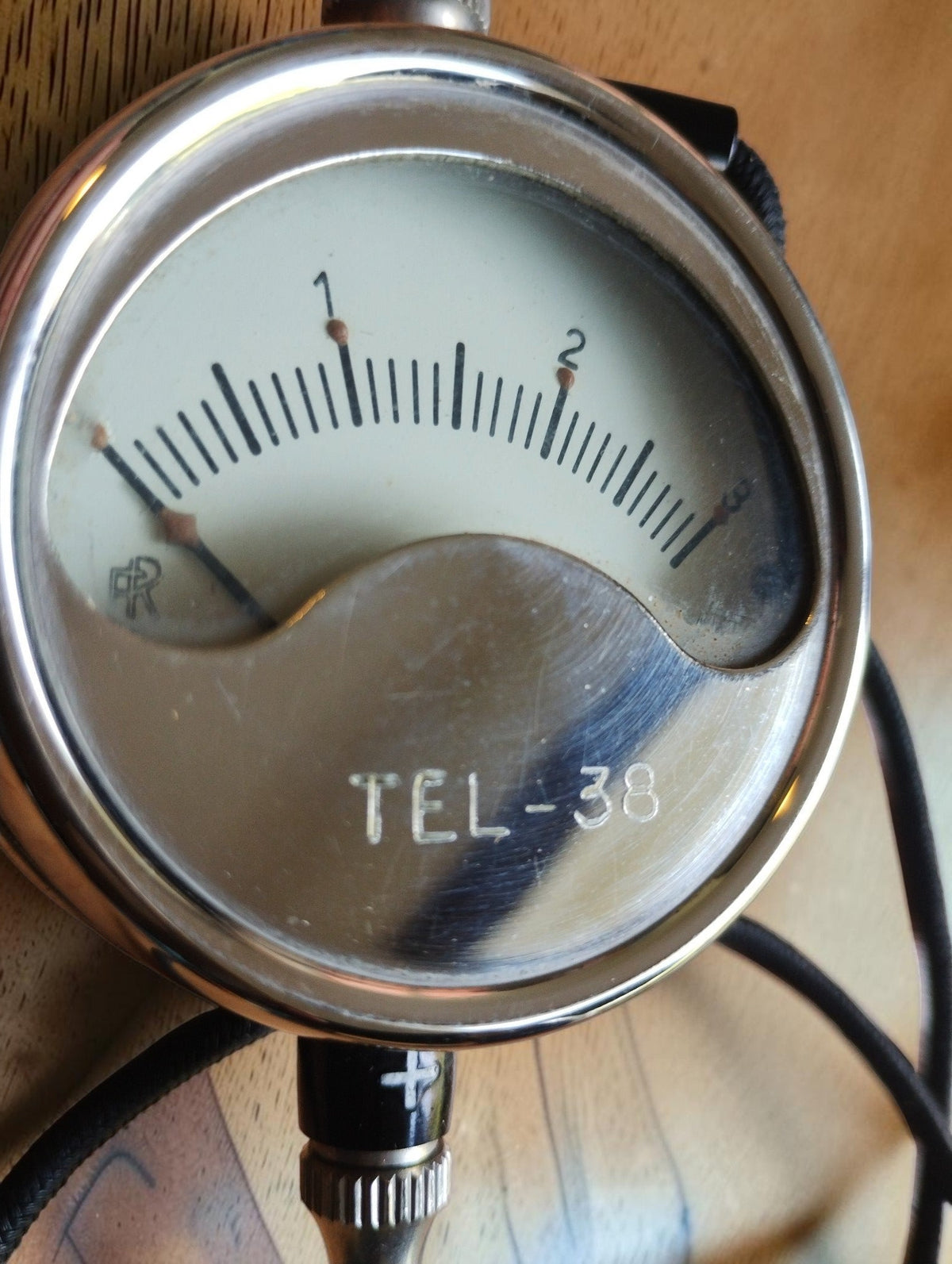 Close-up of Metrawatt TEL-38 voltmeter dial showing the 0–3 scale, MR logo and model marking
