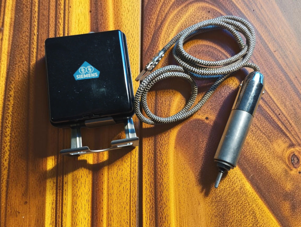Vintage Siemens black Bakelite unit with metal mounting bracket, chrome probe and two-tone woven fabric cord.
