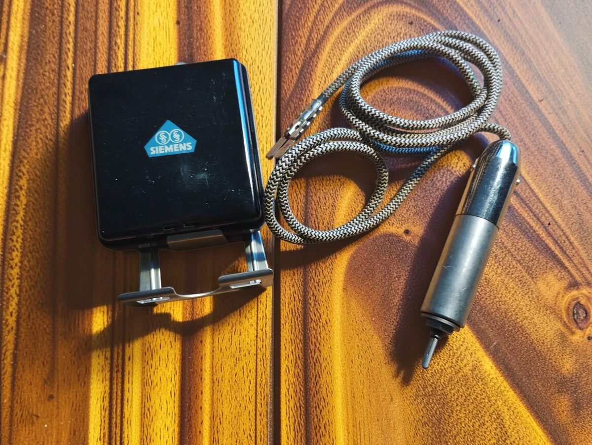 Vintage Siemens black Bakelite unit with metal mounting bracket, chrome probe and two-tone woven fabric cord.

