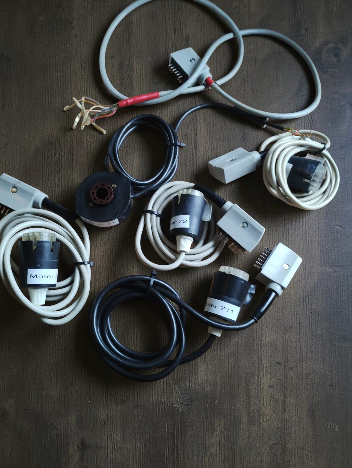 Collection of Müter CRT test adapters and connection cables supplied with the BMR 7 tester
