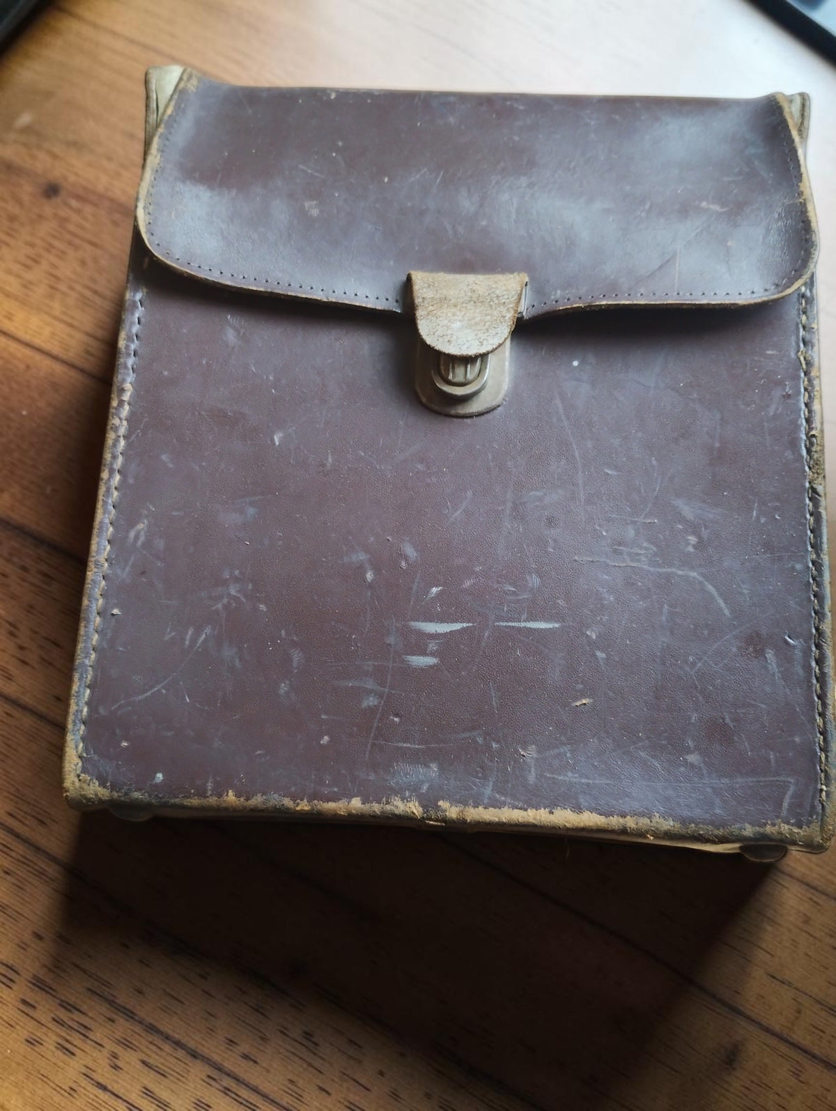 Original brown leather carrying case with metal clasp and visible wear for the Hartmann & Braun milliammeter
