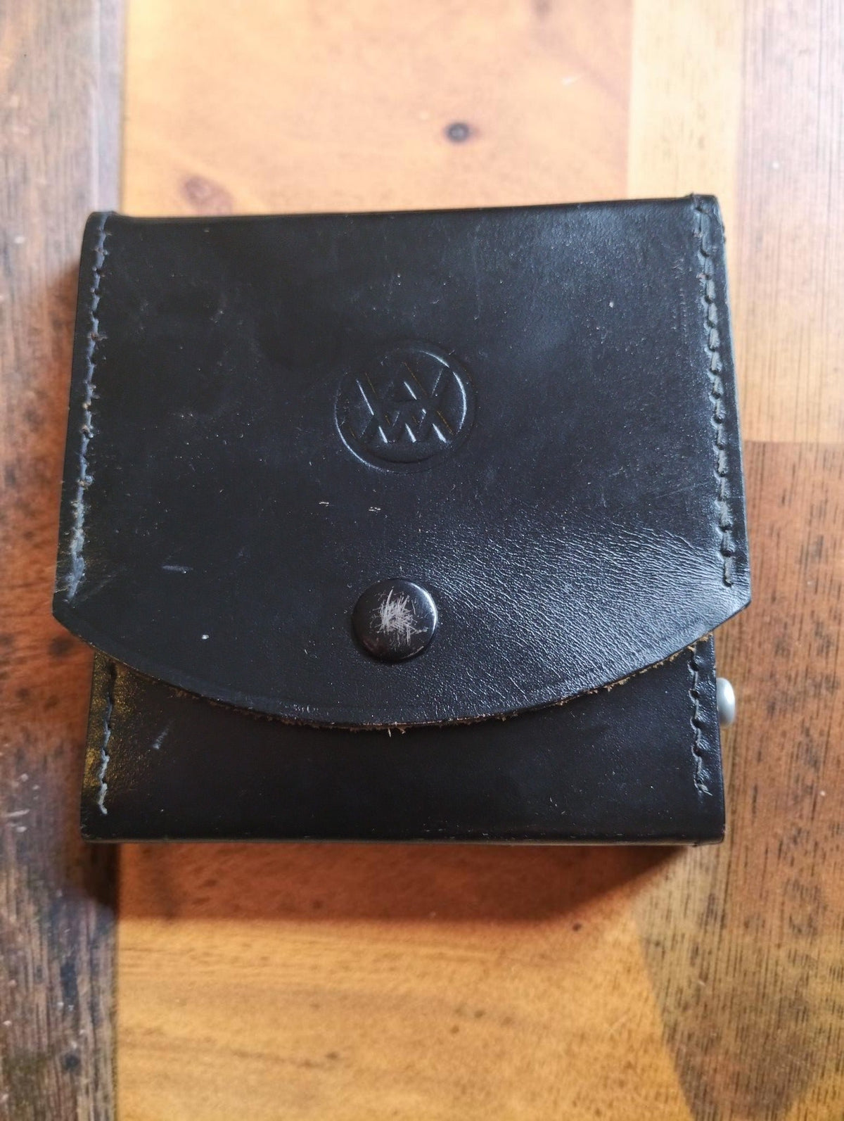 Closed black leather carrying case with embossed logo and stitched edges for a Hartmann & Braun ZEB/W vintage ohmmeter.
