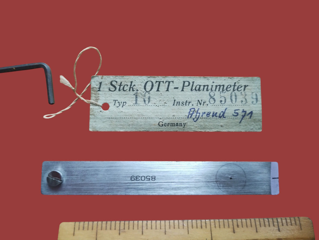 Original OTT planimeter identification tag and metal checking strip marked with serial number 85039
