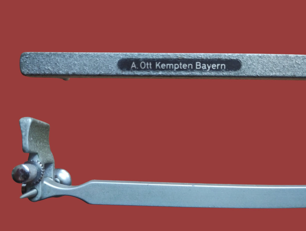 A. Ott Kempten Bayern maker’s mark on the planimeter arm with a close-up of the tracing point assembly
