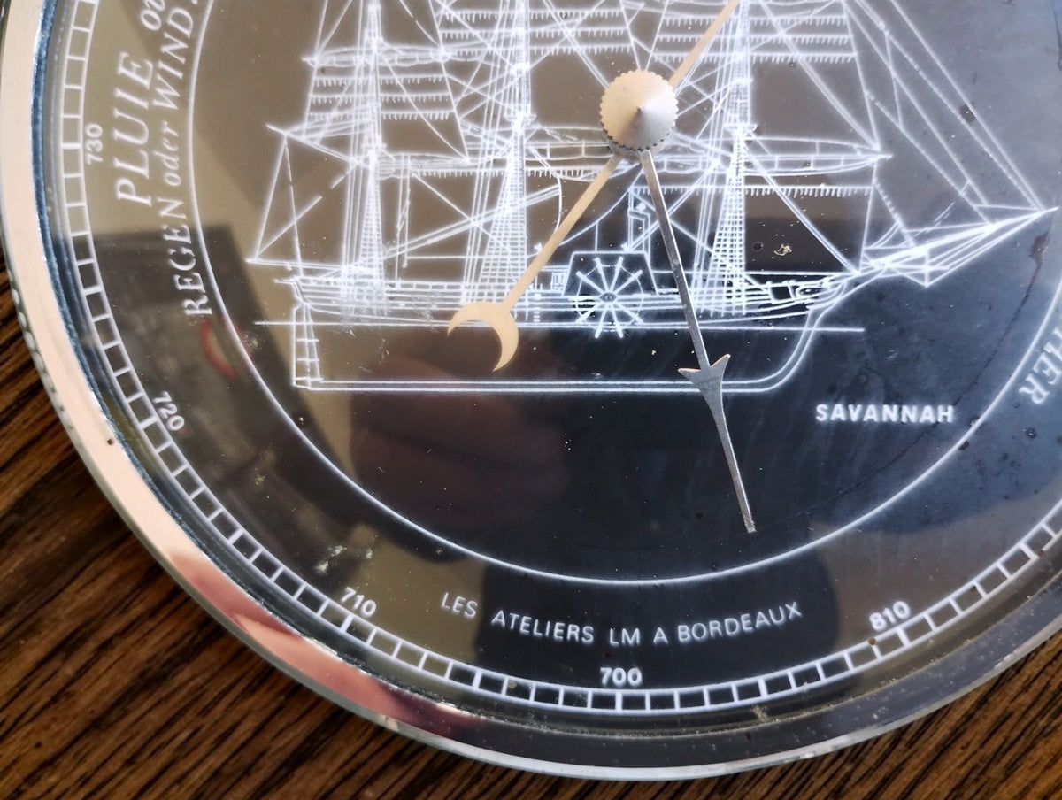 Close-up of the Savannah ship illustration, barometer pointers and Les Ateliers LM a Bordeaux lettering.

