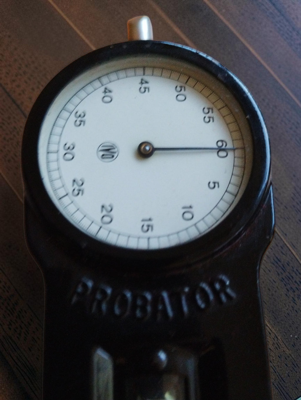Close-up of the seconds dial with IVO logo and PROBATOR name on the black metal housing
