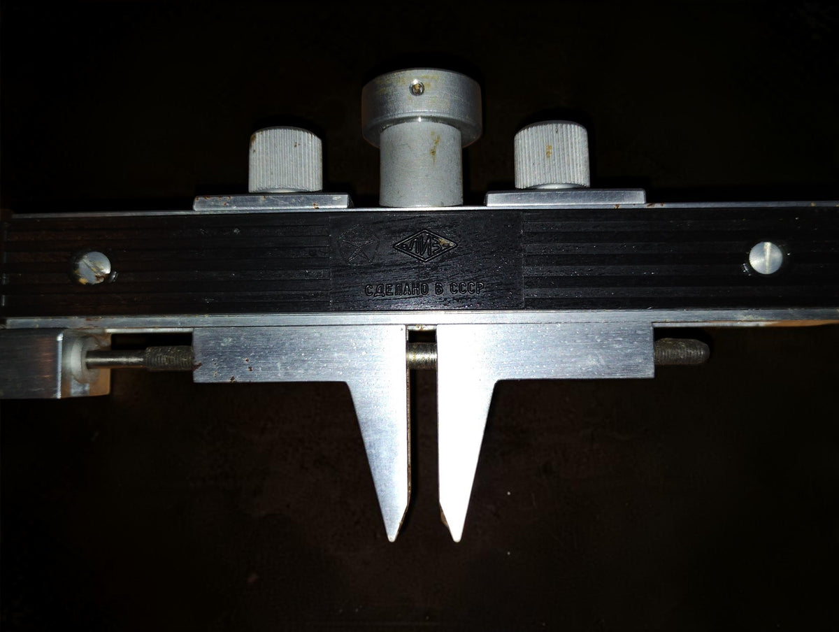 Close-up of the gear tooth measuring frame with LIZ diamond logo and Made in USSR inscription

