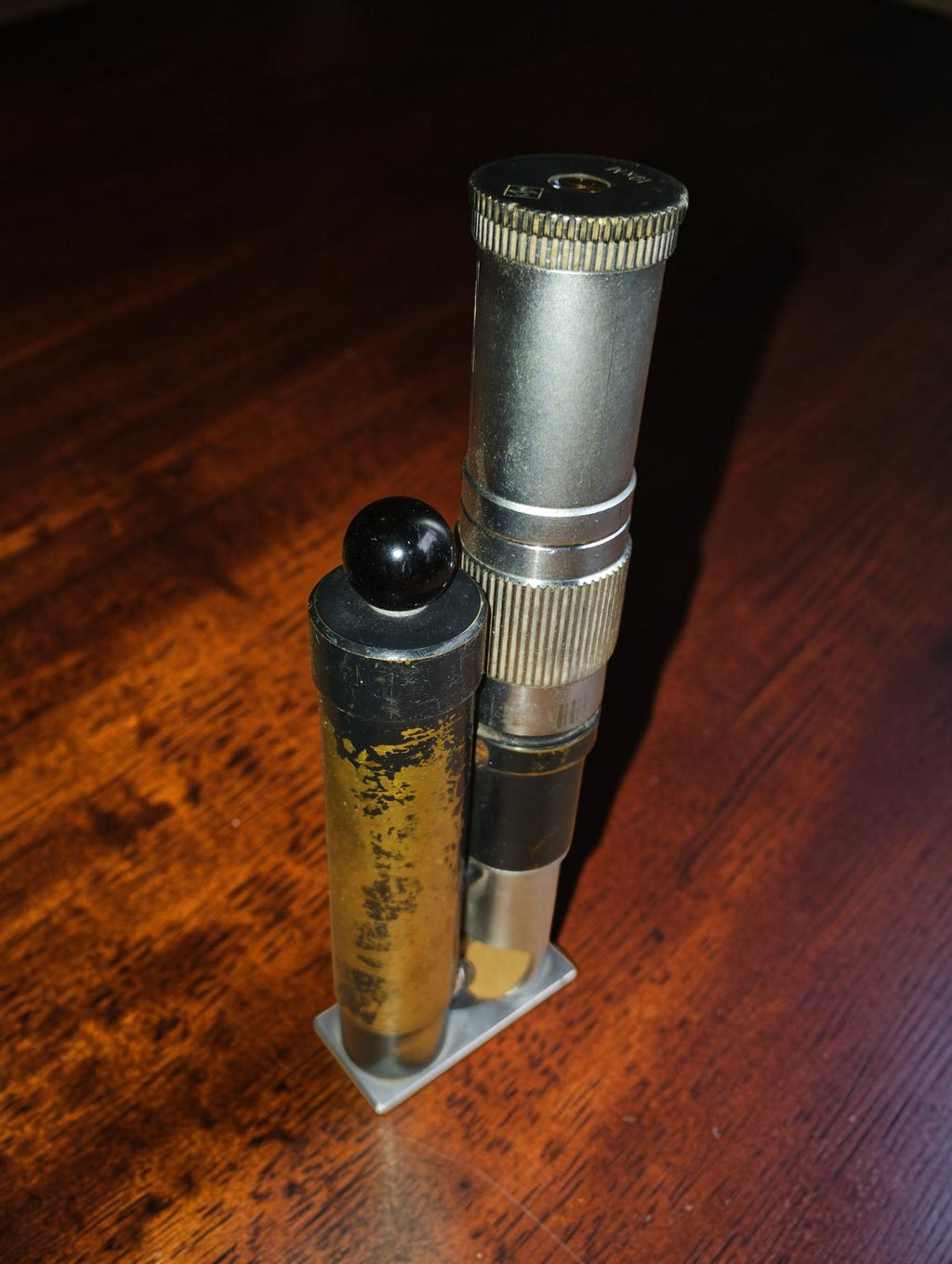 Vintage inspection microscope and attached lamp cylinder, viewed from the opposite side.

