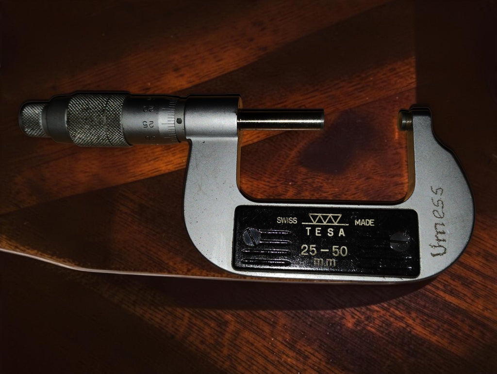 Reverse side of the TESA 25–50 mm outside micrometer with engraved frame markings
