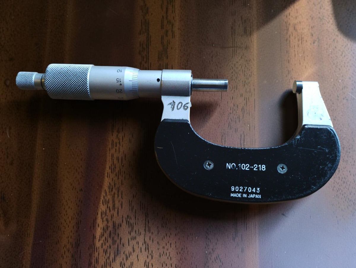 
Rear of the Mitutoyo micrometer showing model No. 102-218, serial number 9027043 and Made in Japan marking.
