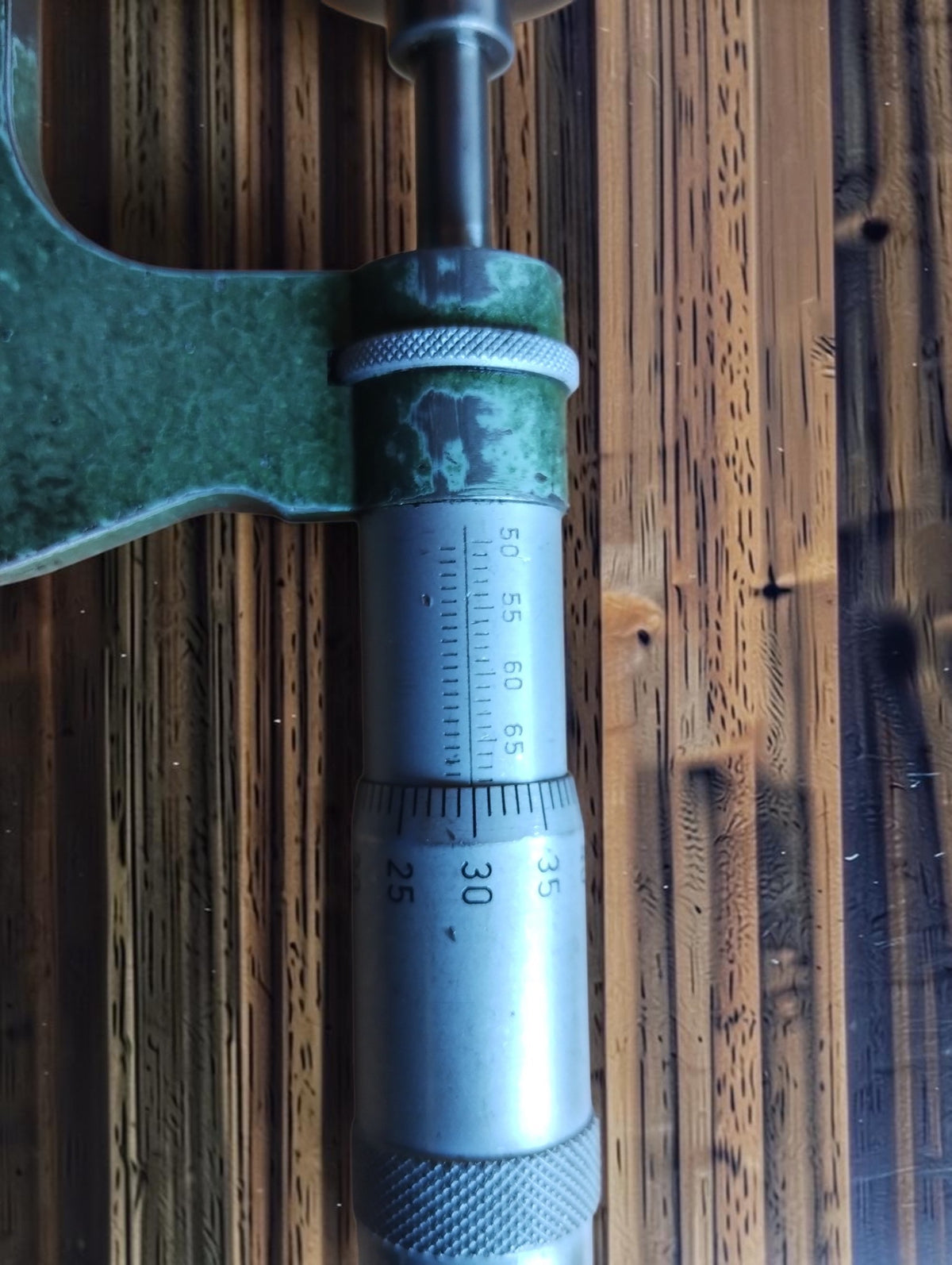 Close-up of the fixed disc-shaped measuring face on the Carl Mahr gear tooth micrometer
