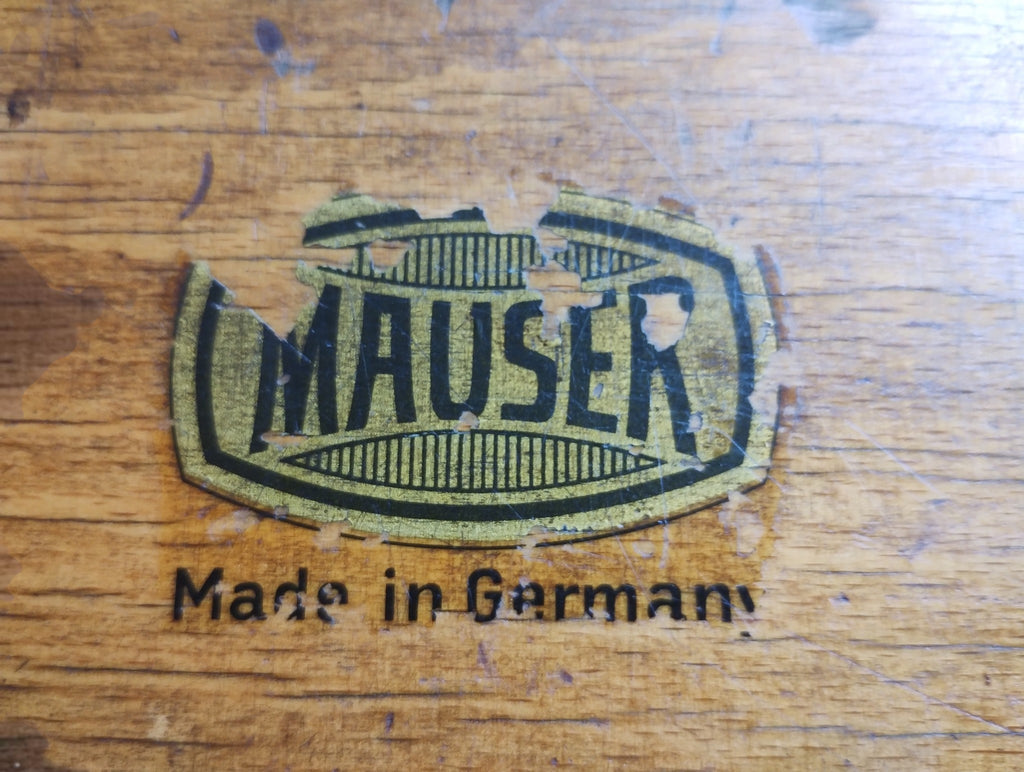 Worn Mauser label on the wooden case with the words Made in Germany.

