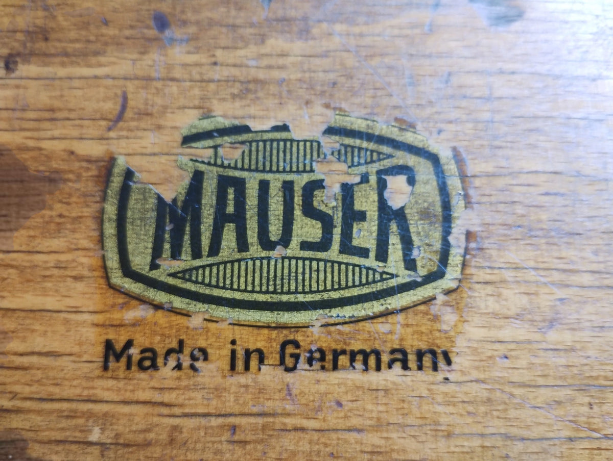 Worn Mauser label on the wooden case with the words Made in Germany.
