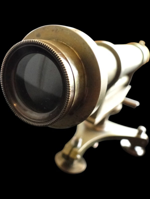 Front objective lens and brass housing of antique surveyor's level