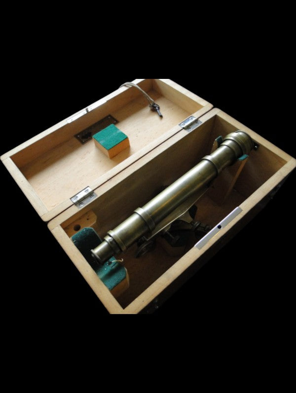 Antique brass surveyor's level stored in fitted wooden transport case