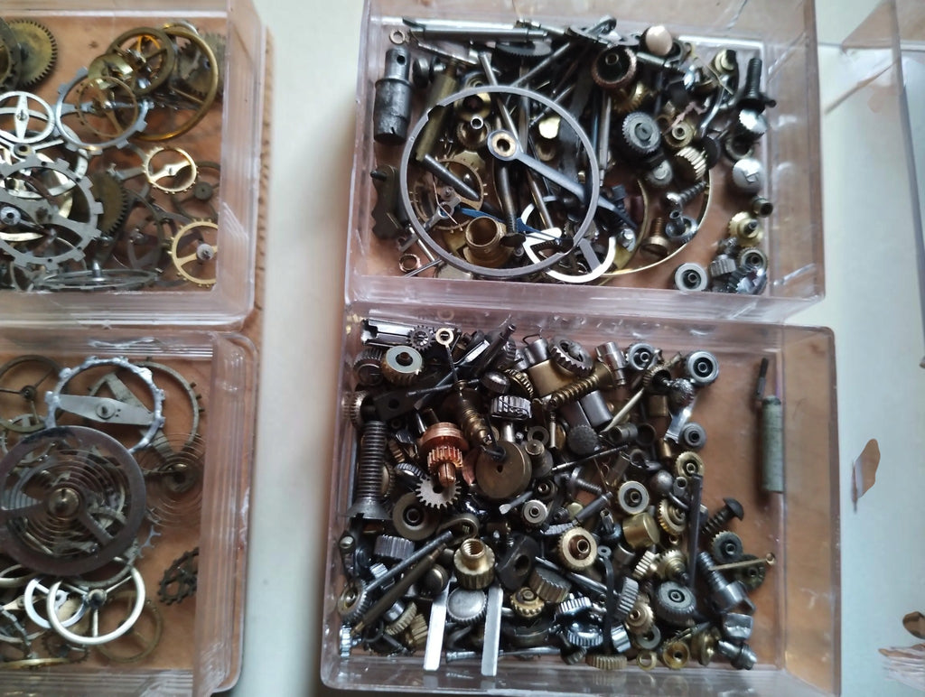 Vintage Watch Movement Parts Lot – Balance Wheels and Gears in Three Boxes

