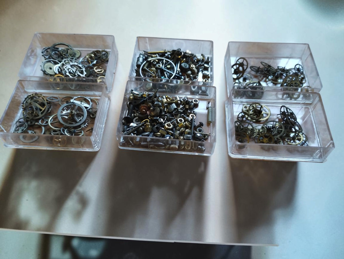 Vintage Watch Movement Parts Lot – Balance Wheels and Gears in Three Boxes
